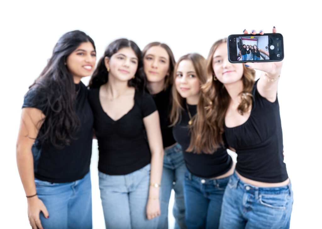 Taryn taking a selfie with her closest friends during her Sweet 16 celebration.